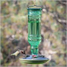 Birds always add some beauty to your garden and thy also help with other important things such as pollination. Antique Glass Hummingbird Feeder Yardbirds