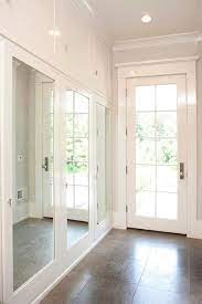 Today, the hall closets in many homes and apartments are filled with an astonishing number of things not remotely related to coats, hats or umbrellas. Mudroom With Mirrored Closet Doors Transitional Laundry Room Closet Door Makeover Mirror Closet Doors Glass Closet Doors