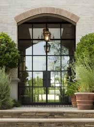 The framing around industrial style steel doors can be pencil thin (unlike wood, which requires a large beam to support a door). Portella Steel Doors Windows Portella Llc Profile Pinterest