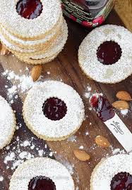 Take the warm cookies from the baking sheet and carefully coat them in the sugar mixture. Traditional Raspberry Linzer Cookies Christmas Cookies