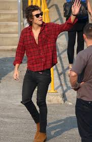 Harry styles opts for trademark casual attire. Harry Styles Street Style Buffalo Plaid Chelsea Boots Mens Street Style Black Pants Outfit Mens Outfits