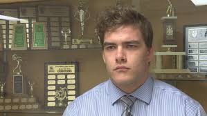 Why do cash-strapped Canadian universities often scrap wrestling programs? 