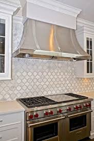 White kitchen backsplash ideas hood. Beautiful Kitchen Features A Stainless Steel French Kitchen Hood Stands Over A White Moroccan Tiled Kitchen Hoods Kitchen Backsplash Designs Kitchen Backsplash