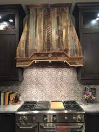 The wood adds so much character and charm to my kitchen, i can't even stand it. Stunning Reclaimed Wood Hood Kitchen Hoods Wood Kitchen Rustic Kitchen
