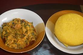 In west africa garri is the powdery food material flour made from the tuberous roots of the cassava plant, which in the process of its manufacture is changed into dry edible granules. Egusi Soup And Garri Stock Photo Adobe Stock