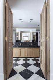 Black And White Checkered Bathroom Floor Tile 9 Spaces That Made Us Want Black White Checkered Floors In 2020 White Marble Bathrooms Checkered Floors Bathroom Interior Design