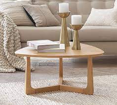 With a neutral color scheme and simple design, this table can mesh with a variety of decor styles. Washburn 33 5 Coffee Table Pottery Barn