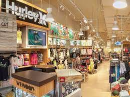 The Interior Of The Curl By Sammy Duvall Shop Featuring Shoes Hats Backpacks And Various Apparel Disney Springs Disney Holiday Disney World Resorts