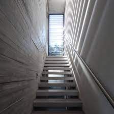 10 Home Interiors That Make Use Of Board Marked Concrete Concrete Interiors House Interior Concrete Stairs