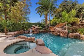 Sparkling Pool With Spa Water Slide And Waterfall Completes A Backyard Oasis Pool Backyard Oasis Water Slides