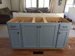 Panels, trim, doors or even just place standard base cabinets and cover the backs with panels. Diy Kitchen Island With Breakfast Bar