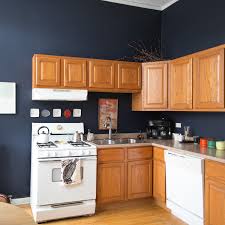 If you have oak or honey toned wood cabinets and want to refresh your kitchen, consider painting the walls in. This Is How To Deal With Honey Oak Cabinets Paint The Walls Midnight Blue Kitchn