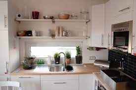 Install a few rods across the glass to hang extra indoor herb planters right. Small Spaces Kitchens Kitchen Design Small Small Kitchen Decor Kitchen Design