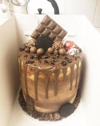 Giant ferrero rocher recipe with video tutorial. Chocolate Drip Cake Dairy Milk Ferrero Rocher Oreo Lindt Maltesers Chocolate Desserts Yummy Cakes Dessert Recipies