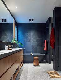 Timber Vanity Dark Grey Tiles And Bath Bathroom Concrete Floor Bathroom Tall Cabinet Bathroom Renovations
