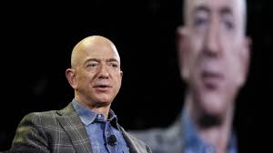 Jeff Bezos consortium buys minority stake in Liverpool, valuing Premier League club at over £5 billion; FSG retains majority control