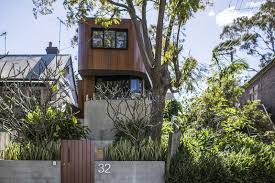 Exterior of a house :: A Curved Wood And Concrete Exterior Greets Visitors To This Home In Sydney