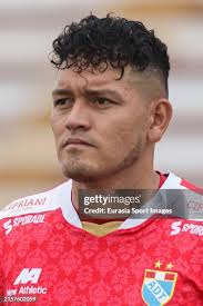 John Narvaez of ADT runs for the ball against Ayrthon Quintana of... News  Photo