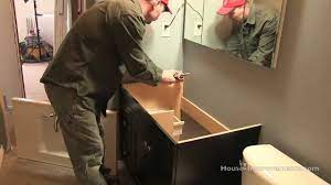 Let caulk dry 24 hours before using sink. How To Install A Vanity Countertop Youtube