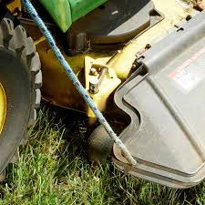The equipment lift will hoist the lawn mower off the ground enough to get underneath to swap out a mangled blade. Lawn Mower Grass Chute Saver Family Handyman