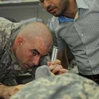 Sgt. Jonathan Strand (left), combat medic with the