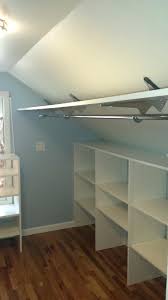 Attic Closet Ideas Walk In Attic Storage Room Includes A Sloped Ceiling Lined With Rustic Wood Beam Attic Bedroom Closets Attic Closet Slanted Ceiling Closet