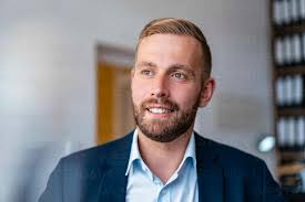 Portrait of smiling businessman in office stock photo