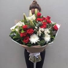 Maybe you would like to learn more about one of these? The Big Bouquet A Dozen Red Roses With Assorted Blooms