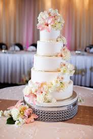 White wedding cake cascading flowers. Five Tier White Fondant Cake With Cascading Flowers