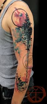 It is not compulsory that all tattoos are to be inked in traditional black color. Watercolor Tree Tattoo On Arm Tattooimages Biz