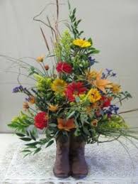 Our florist deliver funeral flowers everyday in france at home, at church and cemetery. Wildflower Cowboy Boot For Sympathy Delivered In Rapid City Sd Fancies Sympathy Funeral Flowers