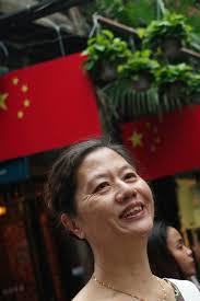 Image of Nina Wang, owner of Chinachem Group, speaks to reporters after