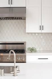 Grey kitchen cabinets with grey backsplash and a white island counter. 15 Stunning Kitchen Backsplashes Diy Network Blog Made Remade Diy