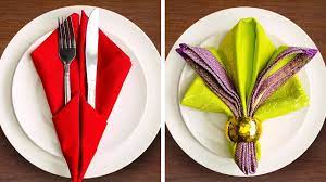 Simply tie a blush pink cloth napkin into a knot and place it on a white plate. 31 Festive Napkin Fold Ideas Youtube