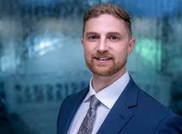 Spotlight on: Wellness Director Patrick Schrader A New York state native,  Patrick holds both a B.S. in biochemistry and an M.S. in Exercise Science.  He began his career as a personal trainer