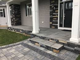 Front porch with stone veneer seating/privacy walls. Stone Veneer Front Entryway Southwick Ma Rjm Landscaping