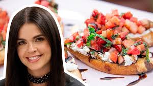 Slices of rustic bread are lightly brushed with olive oil and garlic after being toasted over an open fire. Katie Lee Makes Strawberry Ricotta Bruschetta The Kitchen Food Network Youtube