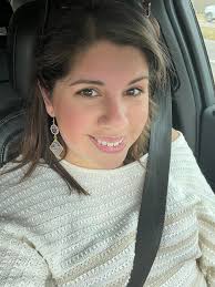 Cooper DeJean's mom made the trip here to LA from Iowa bringing good vibes.  And her Coop 33 earrings. They have good DeGenes in the family!