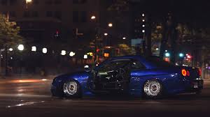 1920x1080 black nissan skyline r34 street fence night lights hd wallpaper. Wallpaper Street Night Sports Car Nissan Skyline Gt R R34 Tuning Nissan Gt R Performance Car Ricer Supercar Land Vehicle Automotive Design Automobile Make Race Track Auto Racing 1920x1080 Jt42