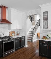 Dark bottom cabinets white upper cabinets. Should I Paint My Cabinets Two Different Colors Paper Moon Painting