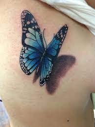 This is a super stunning tattoo for mother and daughter that has two beautiful blue butterflies with something written below them. 3d Flying Blue Butterfly Tattoo On Siderib 3d Butterfly Tattoo Blue Butterfly Tattoo Butterfly Tattoo Designs