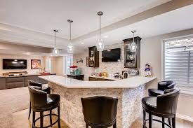 The combined microwave stand and bar cabinet save on space without giving up an ounce of style. 10 Basement Wet Bar Ideas To Impress Your Guests Finished Basements And More