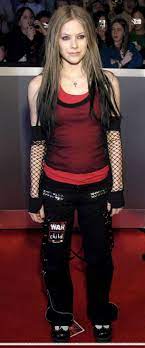 Avril lavigne is bringing some early aughts nostalgia to our feeds with her tiktok debut. 2000s Avril Lavigne Punk Mall Goth Emo Skater 2000s Fashion Outfits 2000s Fashion Fashion