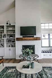 If your brick fireplace is looking dated or has stains and discoloration, it's time to freshen it up with a quick coat of paint. Tv Above Tall Brick Fireplace Builtins 768 1153 Decorology