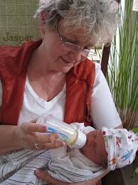 Grandma feeding first bottle