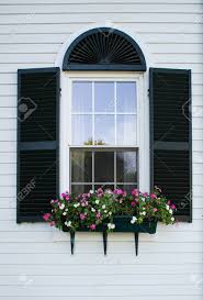 Wooden window box with black semigloss finish. New England Window With Black Shutters And Flower Box Stock Photo Picture And Royalty Free Image Image 52496267