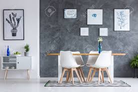 Paint is a relatively inexpensive way to completely transform a room, and dark rooms are no exception. Plant In Grey Pot On White Cupboard In Dark Dining Room With Geometric Carpet And Textured Wall Stock Photo Picture And Royalty Free Image Image 90323502