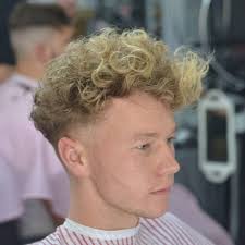 A drop fade gets its name from the fact that its fade disappears behind the ears. 30 Refined Wavy And Curly Hairstyles For Men The Best Options For You