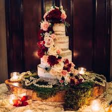 Vintage decor, choice of music, wedding dress styles, and natural colors all have their place when you decide on the country flare. Four Tier Rustic Wedding Cake With Cascading Flowers Get Inspired By These Beautiful Cascading Flower Wedding Cakes