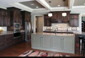 Find inspiration for finding the perfect countertop to pair with your dark cabinetry within this article's photos and helpful design advice! Dark Brown Kitchen Cabinets Grey Island Contrast Dark Brown Kitchen Cabinets Dark Brown Cabinets Stained Kitchen Cabinets